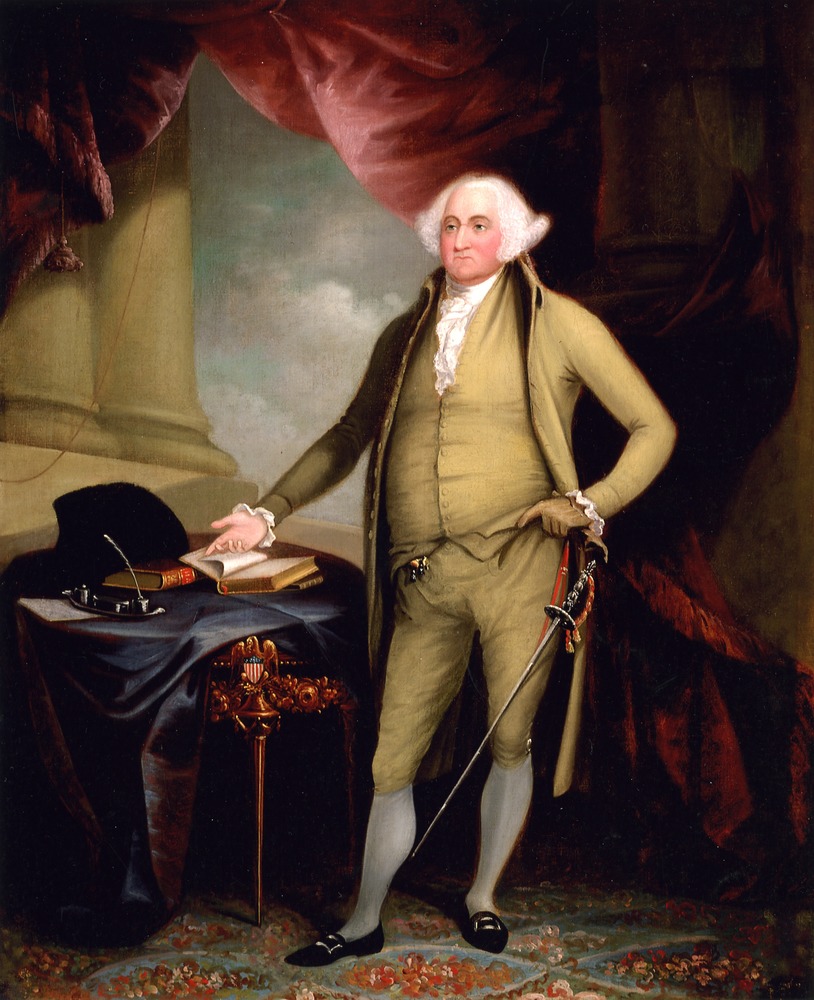 A portrait of John Adams in olive green suit with ceremonial sword, standing at desk and pointing to open book.  On exhibit at Adams National Historical Park.