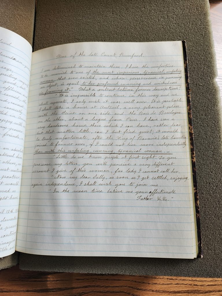 Color photograph of a lined open journal with very neat cursive handwriting in black ink. The quote above is in the first paragraph. 