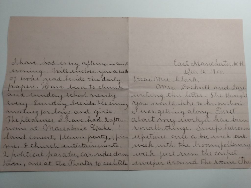 Color photograph of two pages of a letter, written with black ink on pink paper. The letter is addressed from East Manchester, N.H. on December 16, 1900, and begins “Dear Mrs. Clark.”