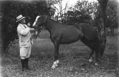 L. F. Hughes and his horse, Lady Spendthrift, at Soledad, Cuba Photograph