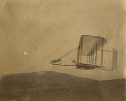 Side view of the Wright glider in flight at Outer Banks, North Carolina, 1903 Photograph