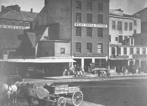 `Old Leather & Feather Store, cor. North St. & Fan. Hall Sq.` Lantern slide