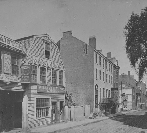 `Tremont St. before widening, looking north from Hollis St.` Lantern slide