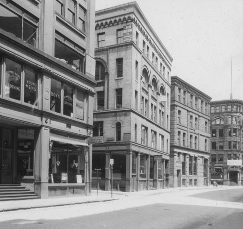 `Cor. Columbia and Essex St., looking east on Essex St.` Lantern slide