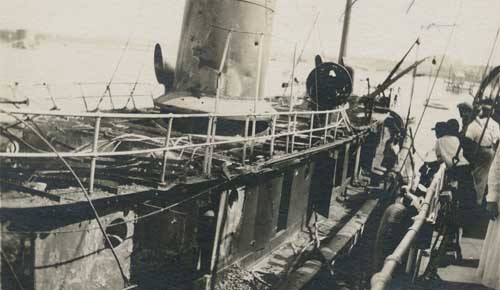 View of the side of Tugboat Perth Amboy after being damaged in attack by the German submarine, U-156 Photograph