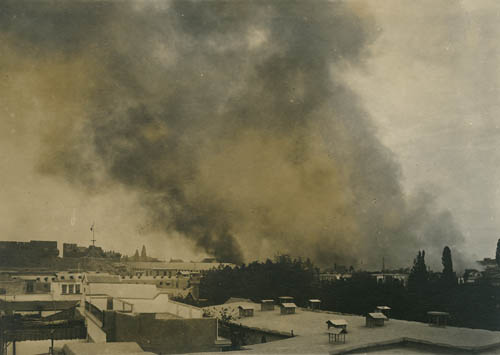 Smoke rises over Damascus Photograph