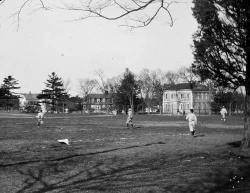 People playing a game in a field, Marion, Mass Lantern slide