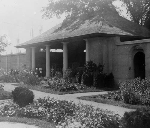 An outdoor, covered patio and garden Lantern slide