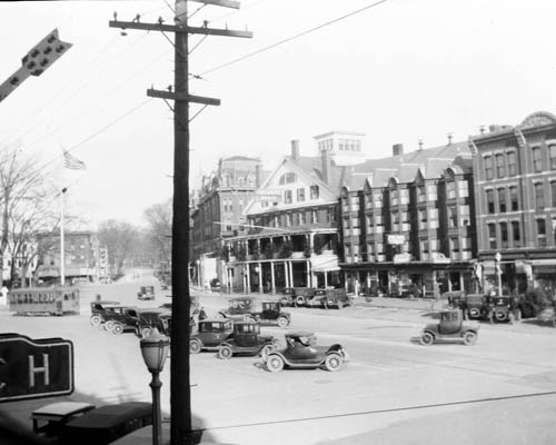 Street scene depicting Cheshire House, automobiles, and streetcar, Keene, New Hampshire Lantern slide