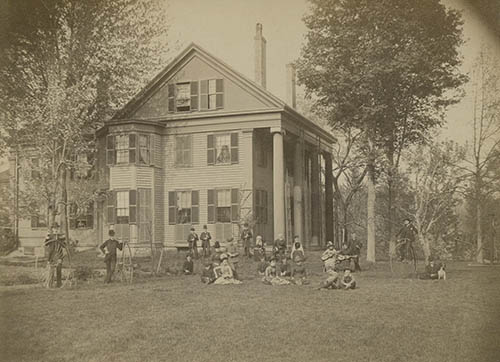 Students and teachers in front of Nathaniel T. Allen`s house, some on bicycles Photograph