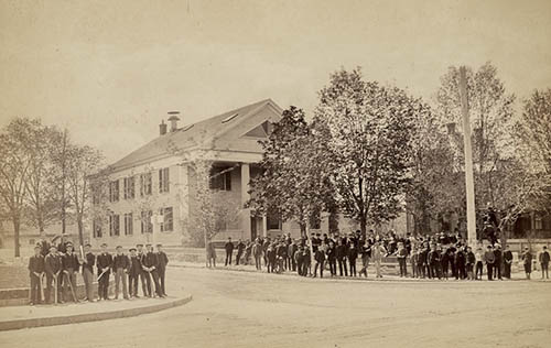 Teachers and students in front of the Allen School building Photograph