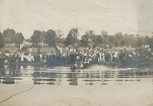 `Rope pull across pond,` Class of 1910 vs. Class of 1909 Photograph