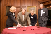 Bill Saltonstall, Emmy Lewis, and George Lewis view the Nora Saltonstall Papers